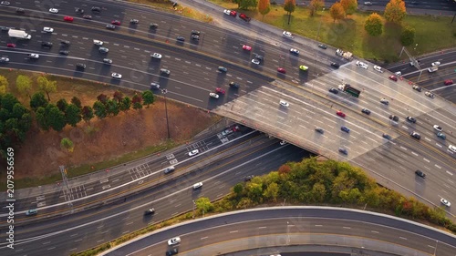 Wide highway cutting through Atlanta city center with steady traffic flow and modern urban architecture.
