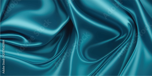 Elegant flowing teal silk fabric, shimmering with light and shadow, creating smooth, graceful folds and a luxurious texture close up.