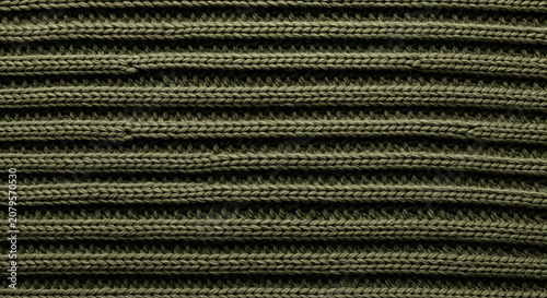 Detailed close up texture of olive green knitted fabric with vertical ribbed pattern fashion apparel and textile backgrounds