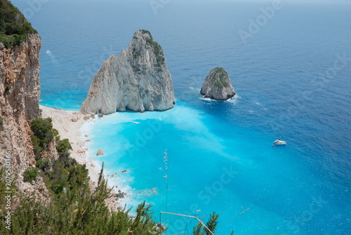 Принти на полотні Panoramic view of the Mizithres sea stacks in Zakynthos, Greece, overlooking crystal-clear turquoise waters and dramatic white limestone cliffs from the iconic cliff viewpoint