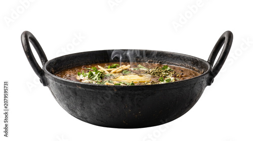 Traditional Dal Makhani in black iron kadai, authentic Indian lentil curry with butter and herbs, steaming hot spicy dal makhani for restaurant menu isolated PNG with Transparent Background