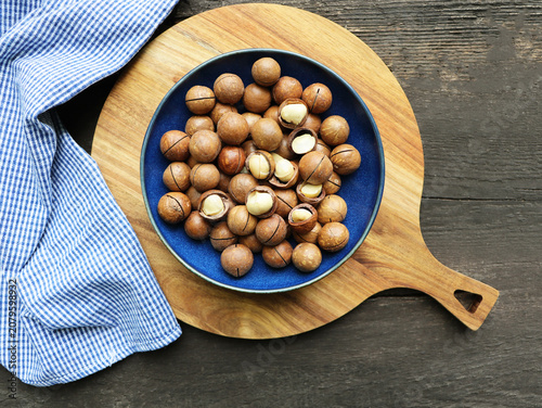 Bowl of Macadamia Nuts on Wooden Board