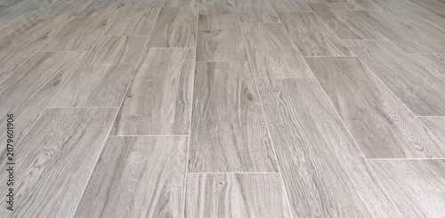 Gray Wood‑Grain Tile Flooring in Clean Staggered Pattern Interior Surface
