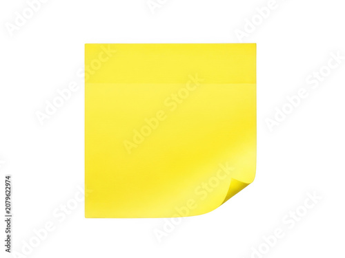 Bright yellow sticky note with corner lifted