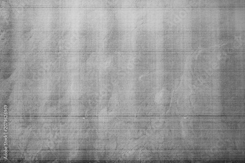 Monochrome macro shot of an inkjet print on a white piece of paper, with interesting patterns and digital textures