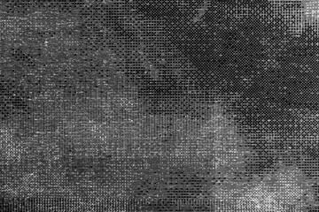 Monochrome macro shot of an inkjet print on a white piece of paper, with interesting patterns and digital textures