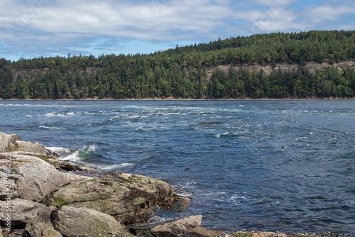 Turbulent water in a narrow passage between islands in the Pacific Northwest