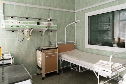 an empty bed in a hospital room.