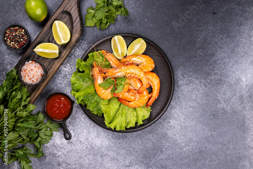 Cooked shrimp with lime, parsley, and dipping sauce