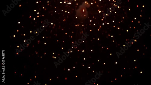 Magical night sky filled with glowing lanterns ascending into the darkness.