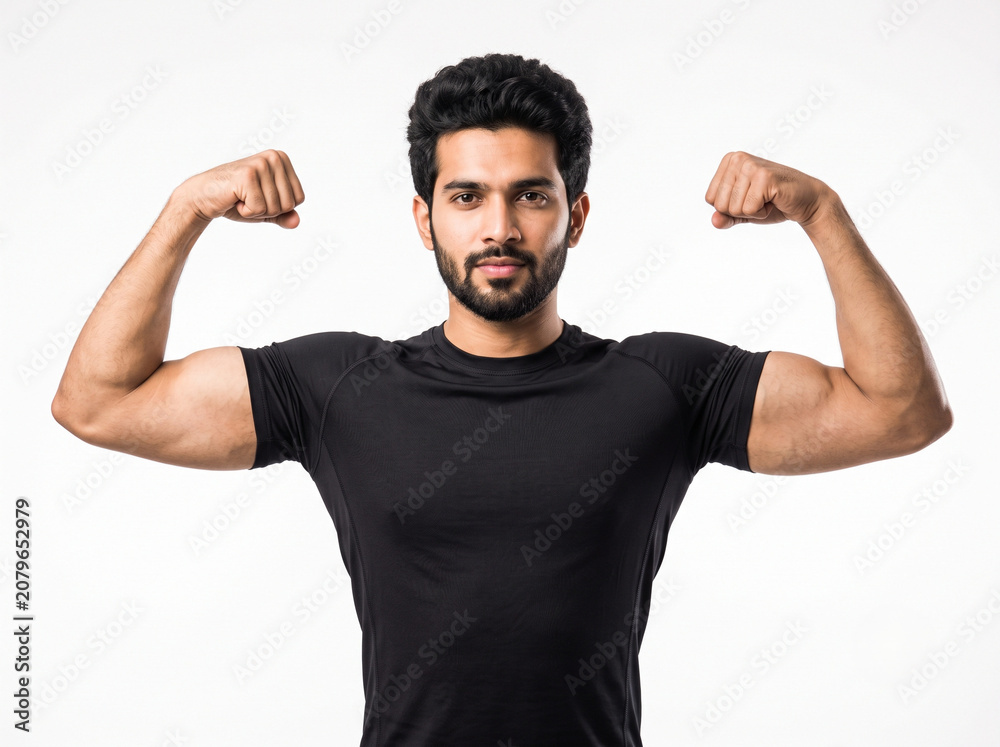 Naklejka premium Young athletic Indian man showing toned arms in a symmetrical double biceps pose wearing a black sports t shirt isolated on white background for fitness campaigns