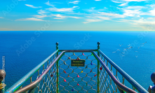 Sea view from the balcony at the famous Victoria viewpoint in Jasmund National Park over the blue Baltic Sea with seagulls and the horizon