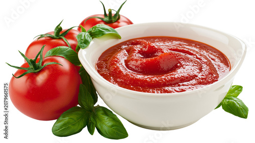 Fotografía Fresh red tomatoes and basil leaves next to a bowl of ketchup, isolated on trans