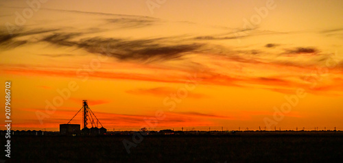Amarillo. A dramatic golden orange sunset sky over Texas, USA, filled with richly textured clouds illuminated by the warm evening light.