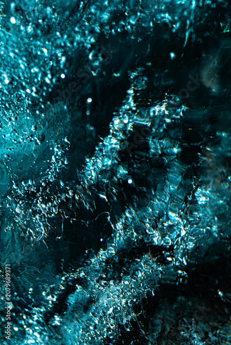Abstract macro shot of frozen blue glacial ice in Iceland