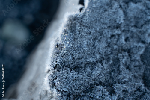 Abstract macro shot of frozen blue glacial ice in Iceland