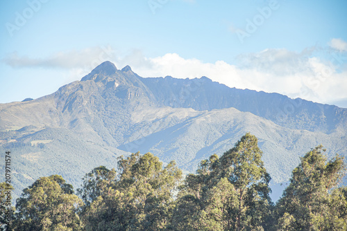Quito, Ecuador - June 29, 2026: The Pasochoa volcano is an inactive volcano located in the Eastern Cordillera of the Andes, illuminated by the last rays of the sun of the day, in a beautiful sunset.