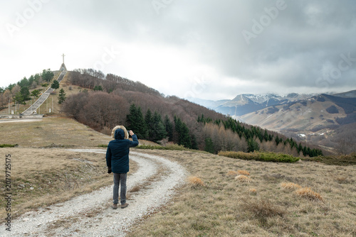Scenic valley view from Monte Zurrone with lone hiker in winter