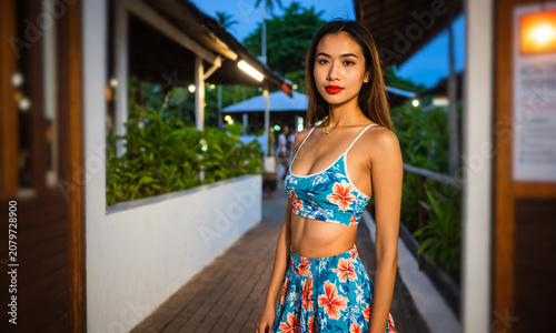 young asian woman in a flor...