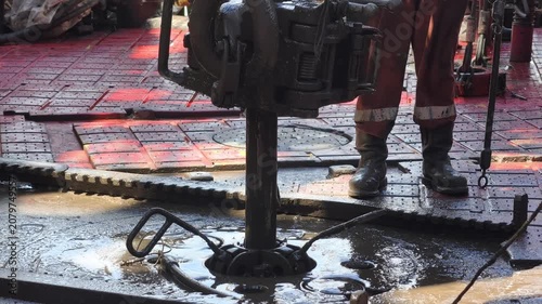 Drilling rig activity - Pull of of hole drill string with oil based mud on the rig floor. Trip out of hole.