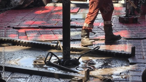 Drilling rig activity - Pull of of hole drill string with oil based mud on the rig floor. Trip out of hole.