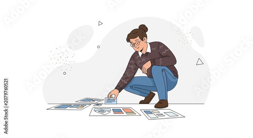 Designer Arranging Layouts on Floor, Focusing on UX/UI Design and Storyboarding Process, Minimalist Flat Illustration Style