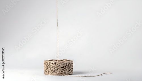 Spool of Twine with Wire on White Background.