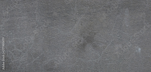 Dark gray slate texture background, natural charcoal stone surface with subtle scratches, moody matte rock finish for architectural design