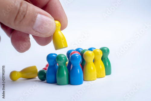 Leadership and team guidance concept with hand selecting a person
