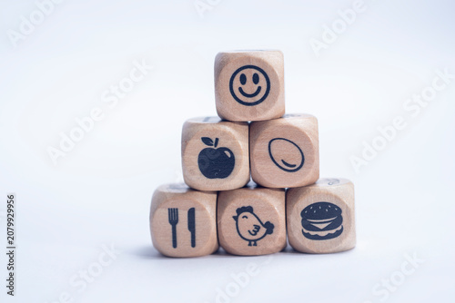 Healthy lifestyle and wellness concept with wooden icon blocks