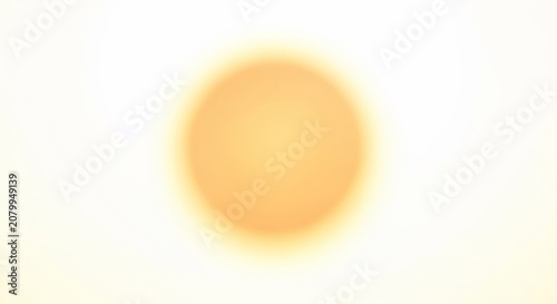 Abstract soft glowing golden circular light orb on white background.