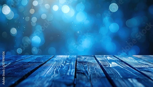 Empty blue wooden table with magical light bokeh backdrop.