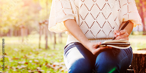 Tableau sur toile Woman Writing Environmental Park Relaxation Concept