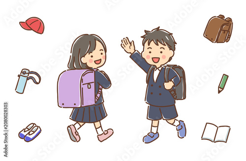 ランドセルを背負った小学生の男の子と女の子・学用品セット