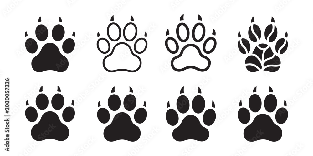 Fototapeta premium Collection of various clawed animal paw prints in outline and solid styles for wild animal design work.