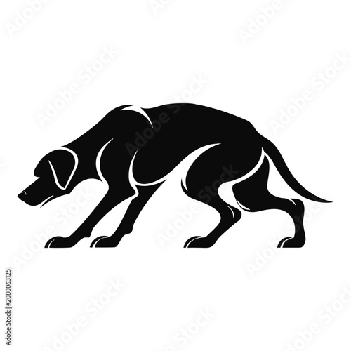 Silhouette of a dog in a stealthy hunting crouch