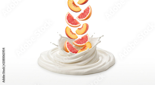 Distant shot of peach and grapefruit slices falling into thick whipped cream with a clean splash