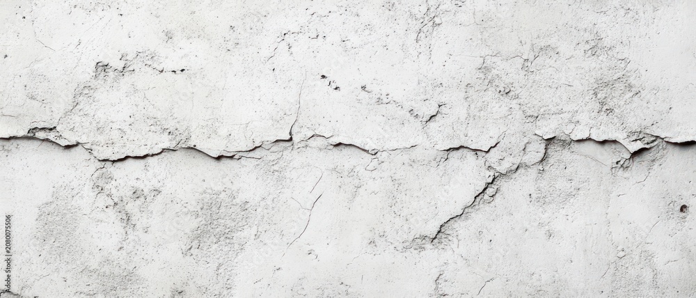 Obraz premium weathered white plaster wall with a long horizontal crack, peeling paint and rough textured surface conveying decay and neglect