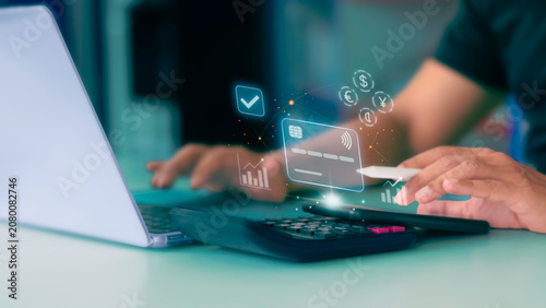 Businessman using smartphone for contactless credit card payment gateway with financial graphics overlay.