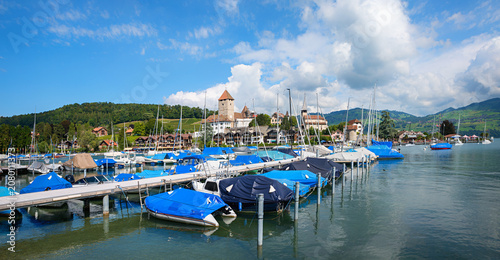 Tableau sur toile pictorial scenery harbor of Spiez, lake Thunersee, landscape switzerland