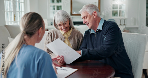 Obraz na plátně Smile, caregiver and old couple in home with document, form and report for medical results