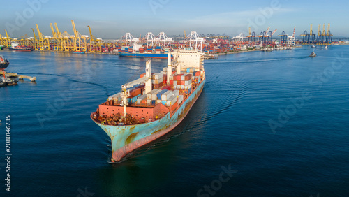 Bild auf Leinwand cargo container ship fully loaded transportation shipping containers navigates through the water busy commercial port terminal equipped loading cranes global maritime logistics supply chain
