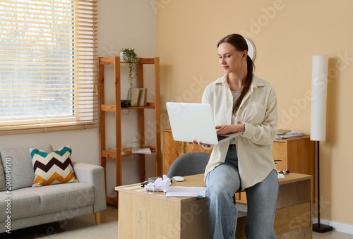 Young woman working on lapt...