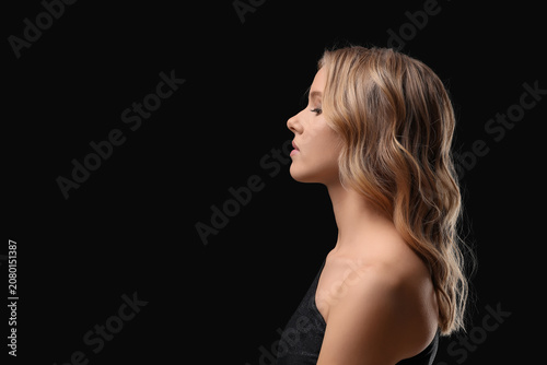 Blonde young woman with cur...