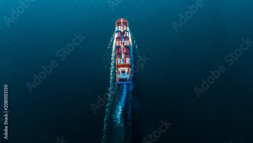 Bild auf Leinwand cargo container ship fully loaded transportaion colorful shipping containers nav