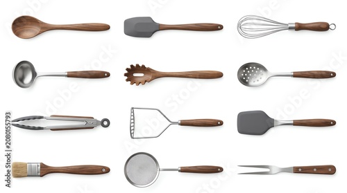 Set of twelve premium kitchen utensil tools with wooden handles for cooking and food preparation isolated on a white background