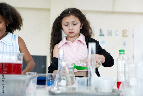 Girls learning about scientist in a science classroom