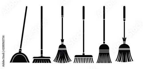 Obraz na plátně A collection of cleaning brooms and dustpans of various styles and sizes, presen