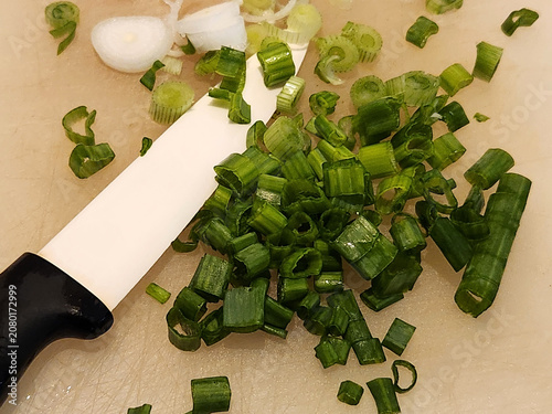 Chopped onion for salad. Knife and chopped onion
