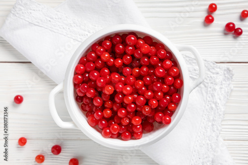 Bowl with fresh viburnum be...